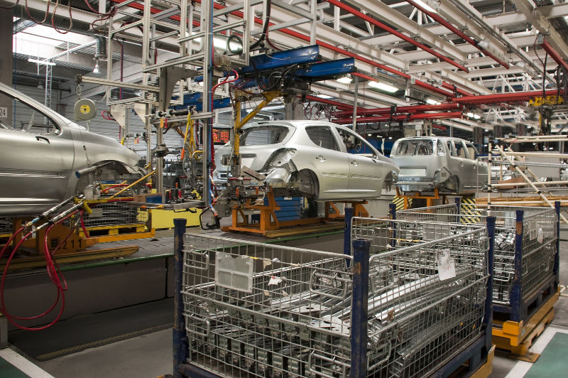 Engineer touch screen control robot the production of factory parts engine manufacturing industry robots and mechanical arm